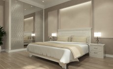 Интерьер спальни в классическом стиле в пастельных тонах.