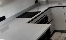 Серая кухонная столешница из искусственного камня Hi-Macs под бетон