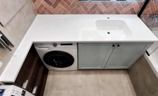 Интегрированная раковина со столешницей из камня Hi-Macs над стиральной машиной